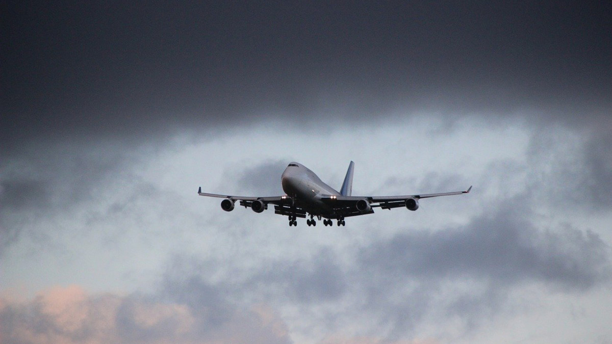 Plane flying in bad weather